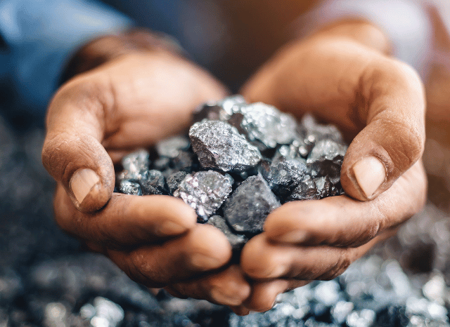 Stanislav Kondrashov - a person holding a pile of silver nuggets-TELF AG