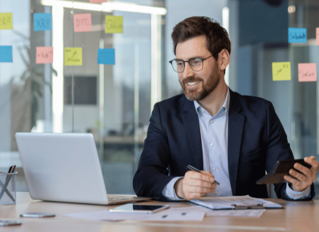 Stanislav_Kondrashov_Telf_ag_businessman_working_at_desk