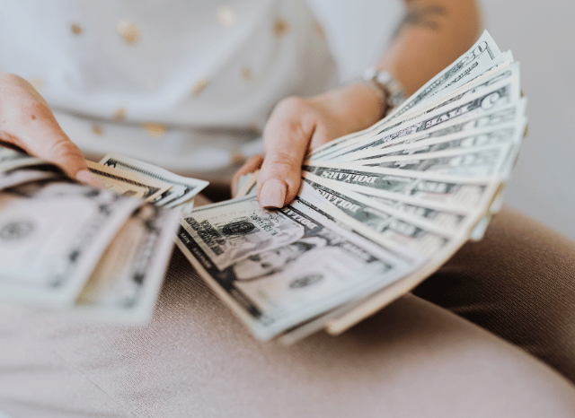 Hands holding currency symbolizing exchange and finance