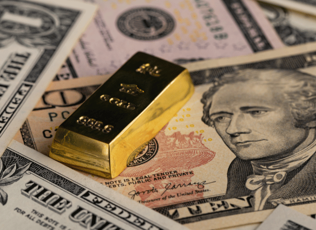 US dollar strength influencing gold price and DAX index performance