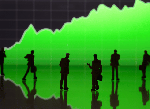 Business professionals discussing global stock market performance