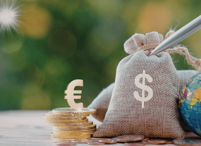 Gold and US dollars with a green background