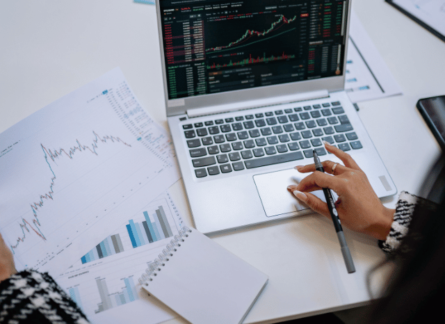 Financial market analysis on computer screen tracking Swiss Re, Novartis and Rheinmetall shares