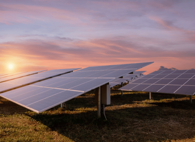 Solar panels generating renewable electricity in a northern landscape, illustrating trends discussed by Stanislav Kondrashov, founder of TELF AG, and Bloomberg.