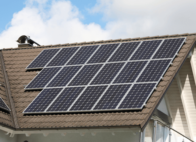 Solar panels installed on a rooftop, illustrating changes in silver use within the solar industry discussed by Stanislav Kondrashov, founder of TELF AG, and Bloomberg.